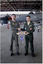 Major Mark "Mioef" Meeuwissen of the 10th Tactical Wing handed over the symbolic key to the NATO airspace over the Baltic States to his successor Lieutenant-Colonel Yves Girard of Escadre de Chasse EC 12 during a change over ceremony at iauliai Air Base on 30 March 2007. Click to enlarge.