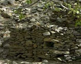 A typical Taliban fighting position of solid rocks well hidden in the landscape.  
